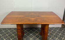 Load image into Gallery viewer, Vintage Art Deco dining table, dating from the 1930s. 
The table is primarily crafted from burr walnut, often featuring highly figured or "book-matched" walnut veneers on the top surface to showcase striking natural grain patterns.
