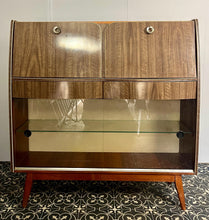 Load image into Gallery viewer, This stylish piece of furniture is a vintage mid-century modern (MCM) bureau and drinks cabinet, often attributed to the maker Hubbinet.
