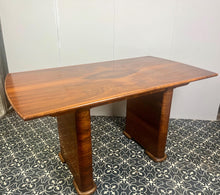 Load image into Gallery viewer, Vintage Art Deco dining table, dating from the 1930s. 
The table is primarily crafted from burr walnut, often featuring highly figured or "book-matched" walnut veneers on the top surface to showcase striking natural grain patterns.
