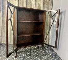 Load image into Gallery viewer, This antique Art Deco furniture piece is a mahogany glazed display cocktail cabinet or bookcase, known for its rich colour and prominent grain, dating from the 1930s.
