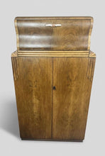 Load image into Gallery viewer, This stunning piece of furniture is an antique Art Deco cocktail cabinet, dating from the 1930’s. It is crafted from figured walnut veneer, a hallmark of the period, known for its distinctive, decorative grain patterns.
