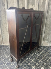 Load image into Gallery viewer, This antique Art Deco furniture piece is a mahogany glazed display cocktail cabinet or bookcase, known for its rich colour and prominent grain, dating from the 1930s.
