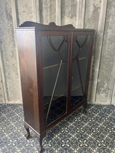 Load image into Gallery viewer, This antique Art Deco furniture piece is a mahogany glazed display cocktail cabinet or bookcase, known for its rich colour and prominent grain, dating from the 1930s.
