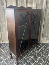 Load image into Gallery viewer, This antique Art Deco furniture piece is a mahogany glazed display cocktail cabinet or bookcase, known for its rich colour and prominent grain, dating from the 1930s.
