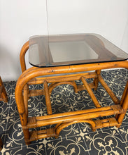 Load image into Gallery viewer, Stylish Italian pair of vintage mid-century modern bohemian bamboo-and-rattan side tables with dark, smoked glass tops.
