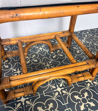 Load image into Gallery viewer, Stylish Italian pair of vintage mid-century modern bohemian bamboo-and-rattan side tables with dark, smoked glass tops.
