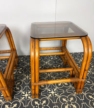 Load image into Gallery viewer, Stylish Italian pair of vintage mid-century modern bohemian bamboo-and-rattan side tables with dark, smoked glass tops.
