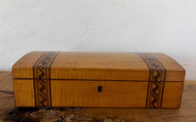 Load image into Gallery viewer, Crafted from stunning, warmly toned figured walnut, this rectangular casket features striking Tunbridge Ware-style geometric mosaic bands inlaid vertically across the domed lid and down the front. The rich, authentic grain contrasts beautifully with the dark, intricate parquetry borders, highlighting the era's skilled handcraftsmanship.
