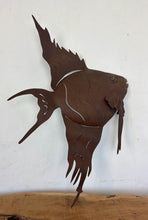 Load image into Gallery viewer, Add a touch of coastal soul and mid-century character to your home with this stunning vintage metal angelfish wall sculpture. Equal parts rustic folk art and bold Brutalist design, this hand-crafted piece features an incredibly expressive silhouette, complete with flowing fins and layered, wavy cut-outs that capture the graceful motion of life underwater.The sculpture has a rich, deep brown finish with a natural, time-worn patina that gives it undeniable antique warmth.
