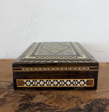 Load image into Gallery viewer, Elevate your vanity or tabletop with this stunning, handcrafted Middle Eastern marquetry box. A beautiful showcase of traditional Damascus craftsmanship, this piece features an incredibly intricate micro-mosaic design pieced together from various toned hardwoods, bone, and genuine mother-of-pearl accents

