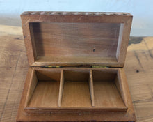 Load image into Gallery viewer, This exquisite Victorian-era antique wooden trinket box showcases a beautiful blend of Art Nouveau organic forms and traditional chip-carving. Originally designed to hold delicate items like postage stamps, jewelry, or small keepsakes, it features a masterfully carved fan and foliage motif on the lid. It serves as a striking decorative statement piece for collectors of historic tobaccoware, stamp boxes, or fine folk art.
