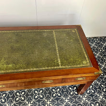 Load image into Gallery viewer, Introducing a unique piece of craftsmanship - a mahogany coffee table in the military campaign style. This stunning table, made in England around the 1950s, features a design that will pique your interest with its formal and executive look.
