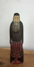 Load and play video in Gallery viewer, Vintage Hand-Carved Wooden Jewish Figurine with Menorah Sculpture – Traditional Folk Art Statue
