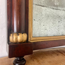 Load image into Gallery viewer, A mid-19th-century rosewood overmantle mirror in landscape form, the frame has classical columns to the sides, and top with gilt collars, and the gilt frame edging has detailed ball feet to create a standout period design.
