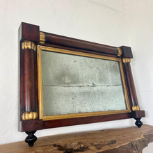 Load image into Gallery viewer, A mid-19th-century rosewood overmantle mirror in landscape form, the frame has classical columns to the sides, and top with gilt collars, and the gilt frame edging has detailed ball feet to create a standout period design.
