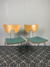 Load image into Gallery viewer, They are introducing a stylish and functional set of chairs from Kusch+Co. The teal blue/green colour adds a touch of retro elegance to any kitchen or dining room. At the same time, the 1970s hairpin legs and atomic-inspired backrests
