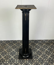 Load image into Gallery viewer, The piece has a beautiful chunky fluted column with a desirable and fashionable ebony tone set with ormolu mounts in a droplet design with floral embellishment in differing lengths on the column a stunning design set on a square base with hidden feet
