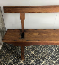 Load image into Gallery viewer, A beautiful Victorian period, pitch pine long, wide and comfortable railway bench, dating from the 2nd half of the 19th century with stunning patina. The bench features an ingenious swing-back design, so it can be sat on from both sides.
