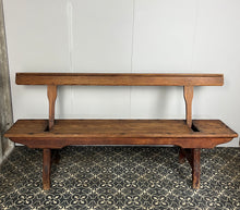 Load image into Gallery viewer, A beautiful Victorian period, pitch pine long, wide and comfortable railway bench, dating from the 2nd half of the 19th century with stunning patina. The bench features an ingenious swing-back design, so it can be sat on from both sides.
