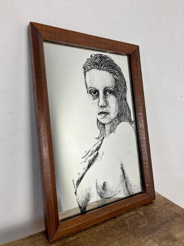 Stunning nude wall art mirror featuring a glamorous lady in a naked style with intricate portrait detail, created in the noir style, will impact your home decor.