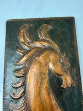 Load image into Gallery viewer, Handmade copper horse head plaque. The hose has a long gracious neck and beautiful big eyes. The horse&#39;s mane is in the air in an oriol around the horse&#39;s head. The horse looks strong.
