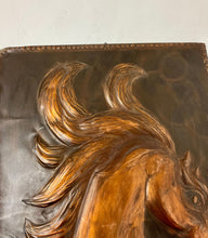 Load image into Gallery viewer, Handmade copper horse head plaque. The hose has a long gracious neck and beautiful big eyes. The horse&#39;s mane is in the air in an oriol around the horse&#39;s head. The horse looks strong.
