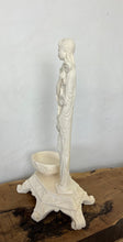 Load image into Gallery viewer, The sculpture is carved from white alabaster stone. The woman&#39;s face is delicate and feminine, with high cheekbones, a small nose and full lips. She is depicted in a flowing gown. Next to her is a shallow pot with beautiful detail on the outside.
