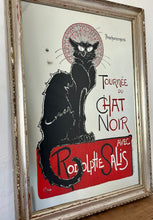Load image into Gallery viewer, The poster features a black cat with piercing yellow eyes. The cat&#39;s silhouette is set against a bold, vibrant background, often in red, black, and yellow shades. Surrounding the cat, there is a flurry of information about the touring shows
