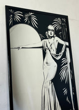 Load image into Gallery viewer, Carole Lombard, in her glamorous gown designed by Irene in the film To Be or Not to Be. The intricate design of her dress and the surrounding palm trees create a beautiful composition that is enhanced by the noir effect finish.
