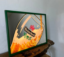 Load image into Gallery viewer, t features a detailed image of a glass of lager poured, with the iconic logo prominently displayed in vibrant colours. The green frame perfectly matches the brand&#39;s colour scheme, and the lightbox is made of durable acrylic material.
