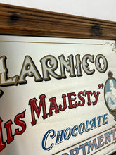 Load image into Gallery viewer, The Clarnico mirror displays a beautiful chocolate collection with a bold font and a detailed image of the king with a crown.
