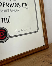 Load image into Gallery viewer, This mirror has a bold font in vivid red tones, a detailed factory picture, additional information about the Australian beer company, and a dual-line border. The mirror comes with a lighter-coloured wooden frame.
