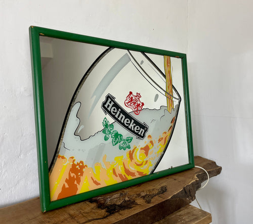 t features a detailed image of a glass of lager poured, with the iconic logo prominently displayed in vibrant colours. The green frame perfectly matches the brand's colour scheme, and the lightbox is made of durable acrylic material.