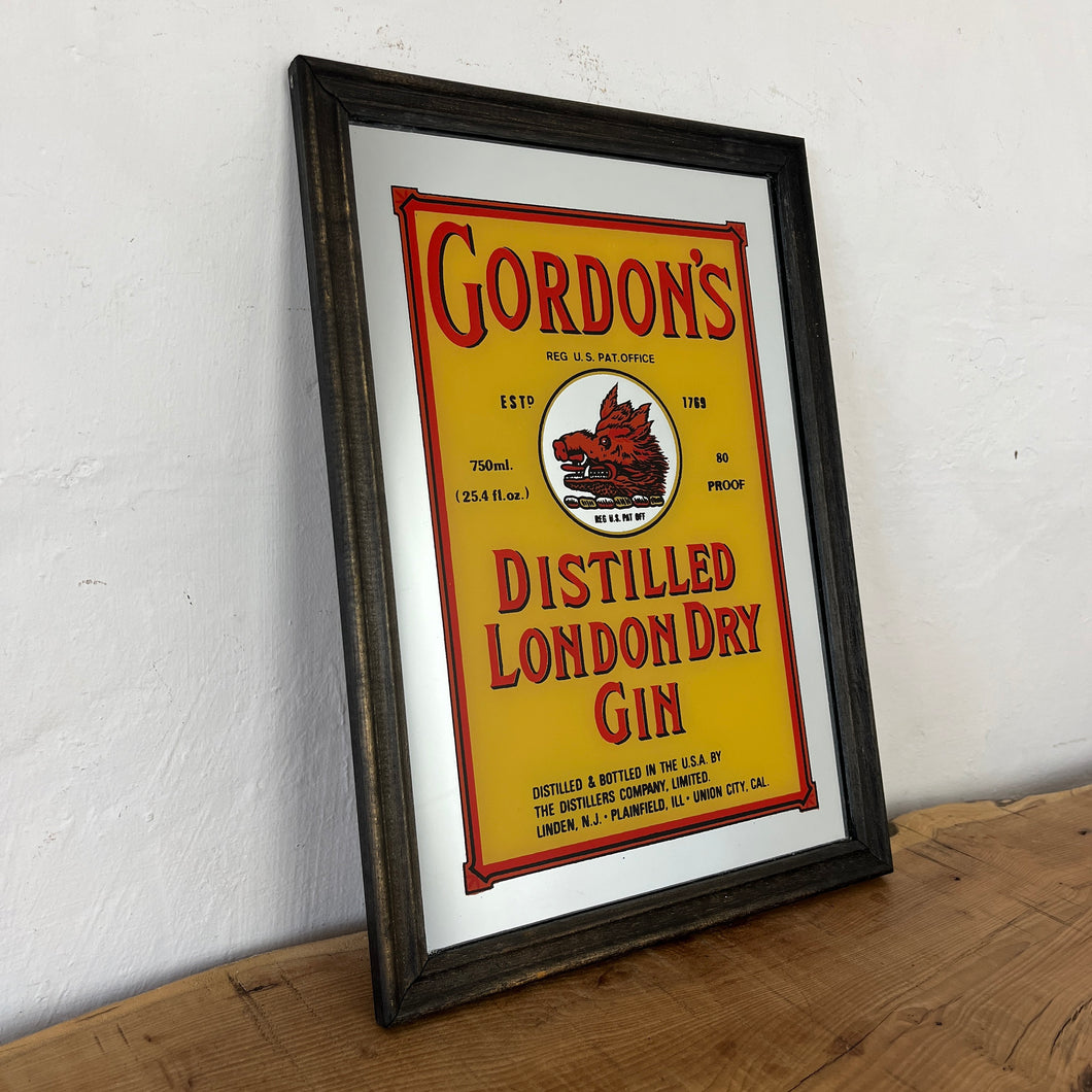 The stunning design features the famous London gin brand in vivid red fonts, a border, and a vibrant yellow background with the familiar logo on the boar's head.