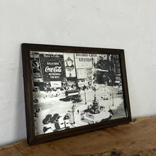 Load image into Gallery viewer, The artwork depicts a beautiful landscape design of Piccadilly Circus in a noir effect. The vintage image showcases the famous London landmark with its advertisement screens and the road that features vintage black cabs and iconic buses
