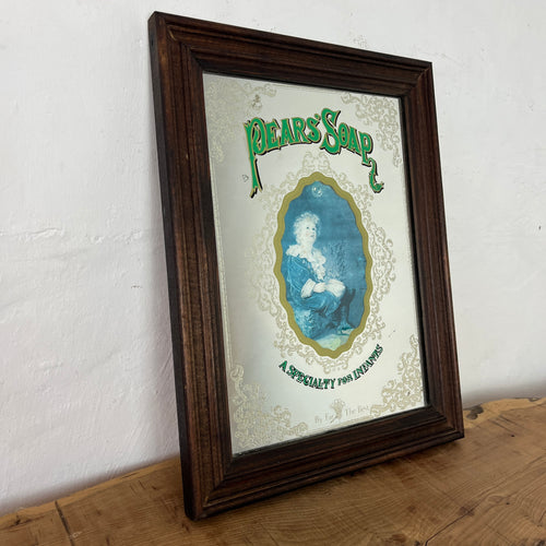 An Appealing Vintage mid-century Pears Soap Advertising mirror featuring an antique child in an oval frame with a Victorian intricate border and stand-out fonts with a green hint.