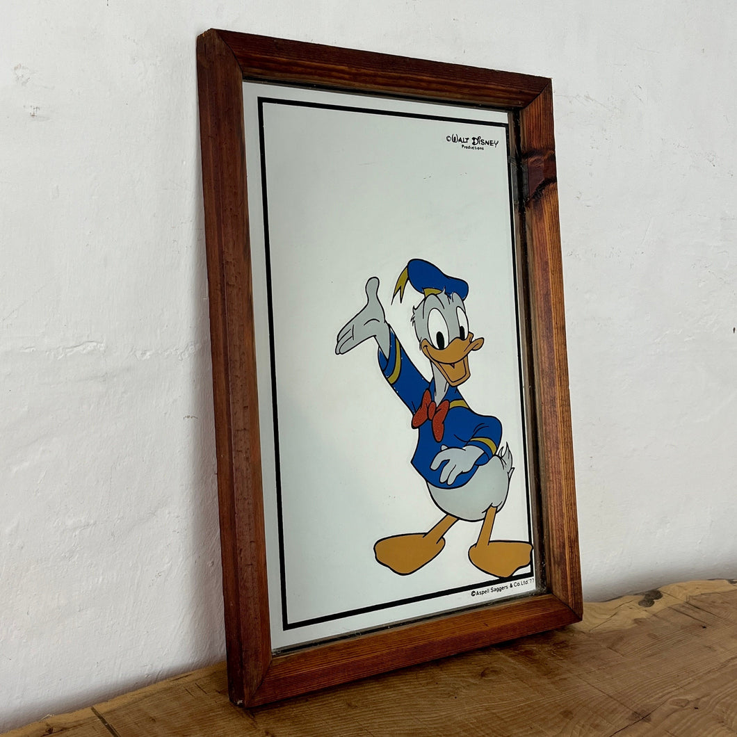 Magical Donald Duck mirror with vivid colours wearing his iconic clothing with vibrant tones viewed on one of his better happy days created my Aspell Saggers in 1977 with Walt Disney production mark.