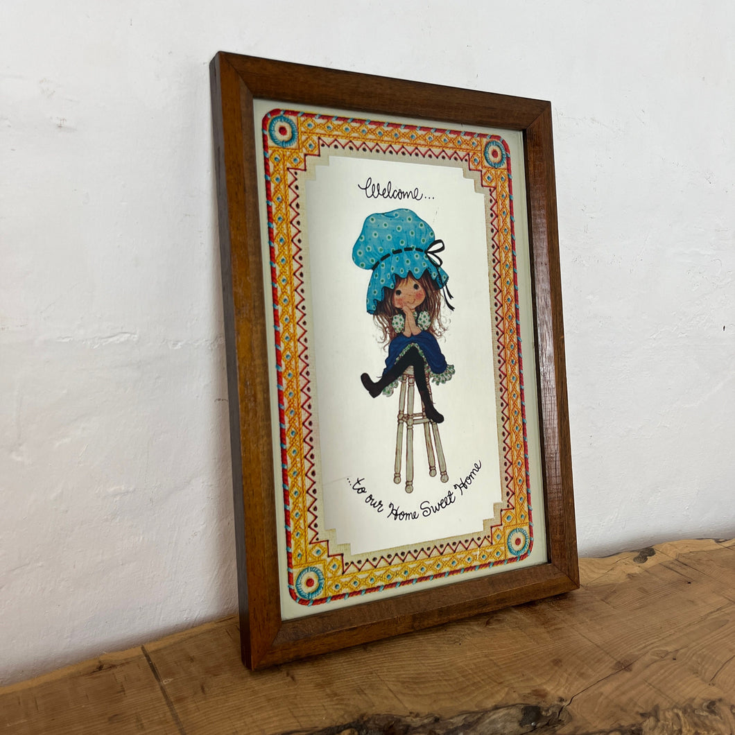 The mirror depicts Miss Petticoat in vibrant colours and would make a great addition to any art collection. Intricate, vivid border, welcome to our home sweet home.