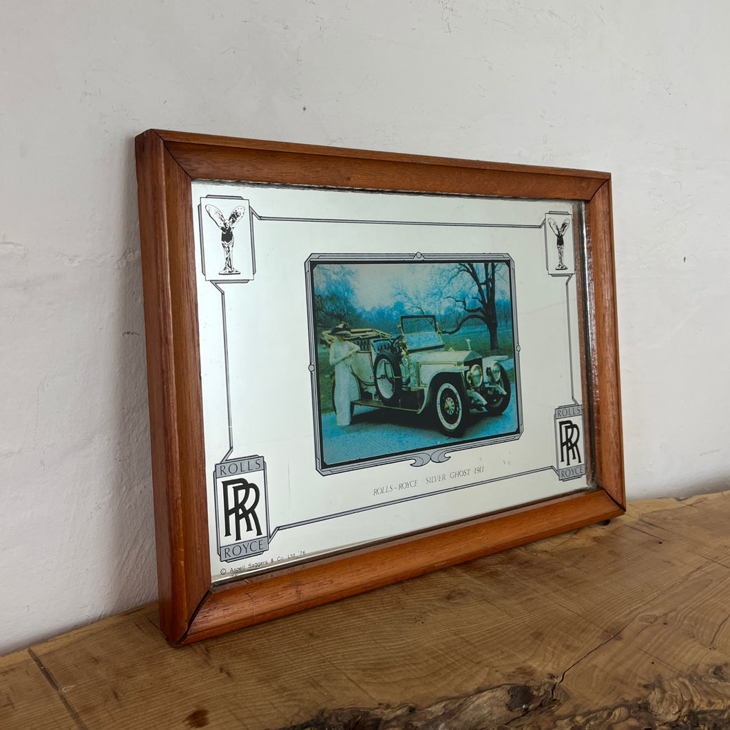 Vintage stunning Rolls Royce Silver Ghost 1911 advertising mirror featuring a glamourous design with antique pictures of the luxury car in a royal setting with an elegant lady, art deco finish with the borders, and the famous branding.