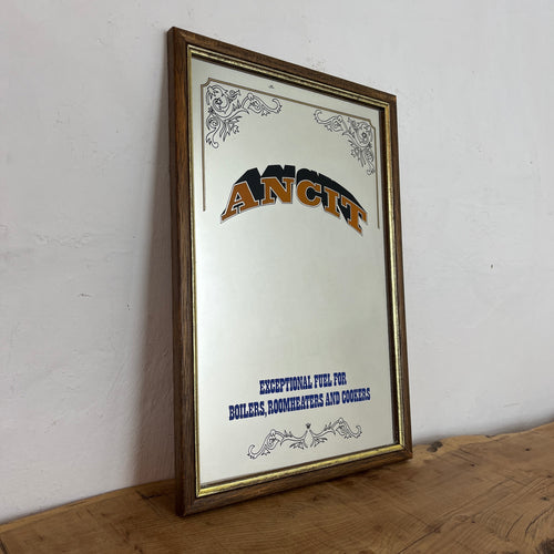 Striking Ancit fuel mirror with vivid bold fonts on the branding with further wording toward the bottom with an intricate Victorian border to create a stand-out advertising piece.