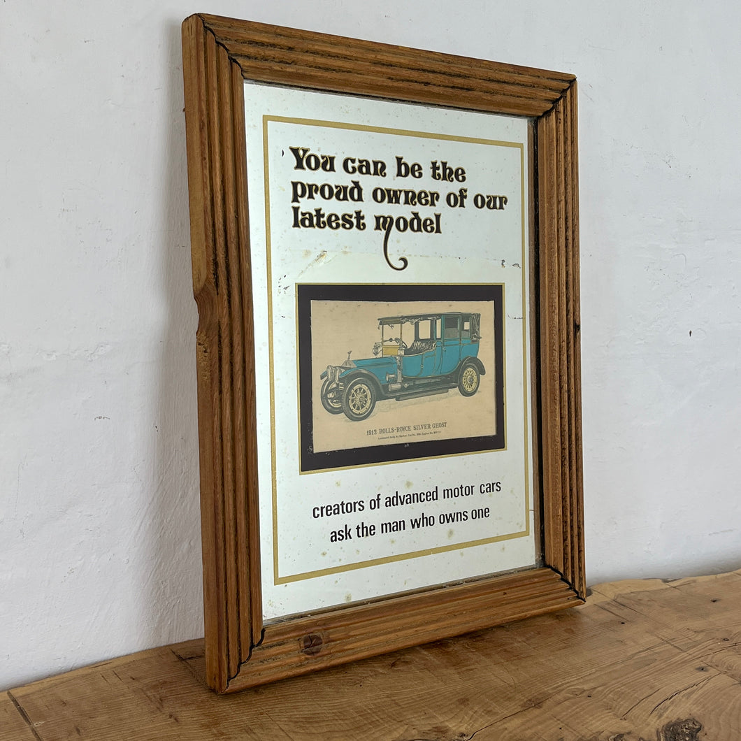 Vintage prestige Rolls Royce Silver Ghost 1912 advertising mirror featuring a glamourous design with antique pictures of the luxury car in intricate finish, excellent quotes in stylish fonts with a straight gold border.