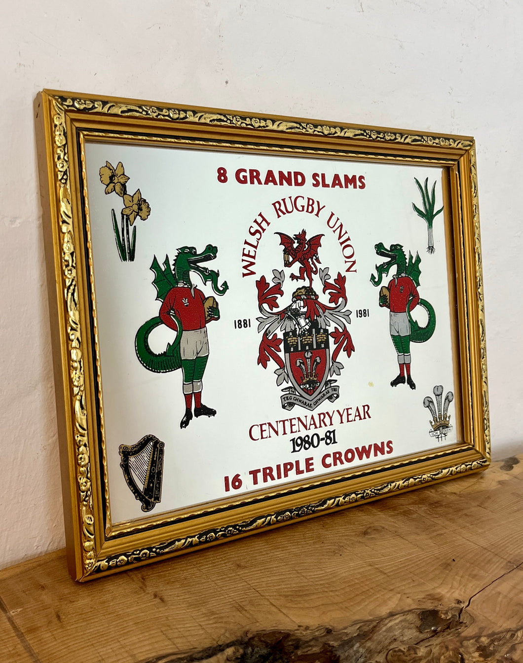 Featuring detailed Welsh plaque and pair of intricate Welsh dragons with vivid tones and Guinness harp logo, tradition Welsh icons including daffodils, leeks and triple feather and crown a nice rugby collectable.