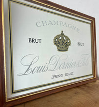 Load image into Gallery viewer, Louis Doinier and Fils Champagne brut advertising mirror in an elegant design of the famous French champagne producer with multiple classy fonts on the branding with the intricate gold crown logo and a sleek gold and black border.
