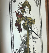 Load image into Gallery viewer, Beautiful Mucha collectables piece features an elegant lady with a stylish dress in an matt gold finish flowing down with a vivid robe holding a large bouquet with a beautiful floral background and the vibrant, intricate border.

