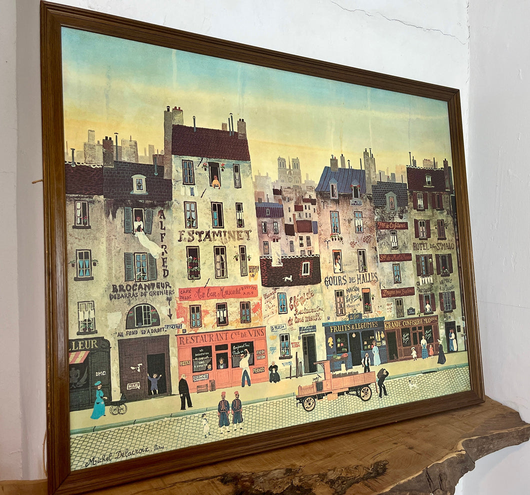 Beautiful Michel Delacroix, titled Au Bon Muscadet, Street scene print of board marvellous picture with stunning detail on a French Street featuring many different characters doing various jobs and many vibrant businesses and apartments.