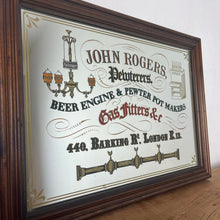Load image into Gallery viewer, It&#39;s a fantastic vintage framed advertising mirror. John Rogers, Pewterers Beer Engine &amp; Pewter Pot Makers, Gas Fitters, located at 440 Barking Rd. London E.13 has vivid fonts in a Victorian style, many styles, and hints of glamorous colours.
