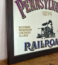 Load image into Gallery viewer, Historical Pennsylvania Railroad Company 1874 advertising mirror, showing the detailed steam train in a intricate noir design, bold stand out font with multiple vivid tones, with a list of the cities where the station are located.
