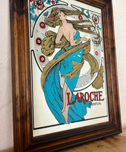 Load image into Gallery viewer, Stunning art nouveau mirror featuring a glamorous lady wearing an elegant dress and scarf with an azure blue design with her hair flowing across the mirror in the background continues with the flower design with an intricate pattern.
