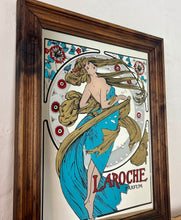 Load image into Gallery viewer, Stunning art nouveau mirror featuring a glamorous lady wearing an elegant dress and scarf with an azure blue design with her hair flowing across the mirror in the background continues with the flower design with an intricate pattern.
