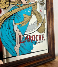 Load image into Gallery viewer, Stunning art nouveau mirror featuring a glamorous lady wearing an elegant dress and scarf with an azure blue design with her hair flowing across the mirror in the background continues with the flower design with an intricate pattern.
